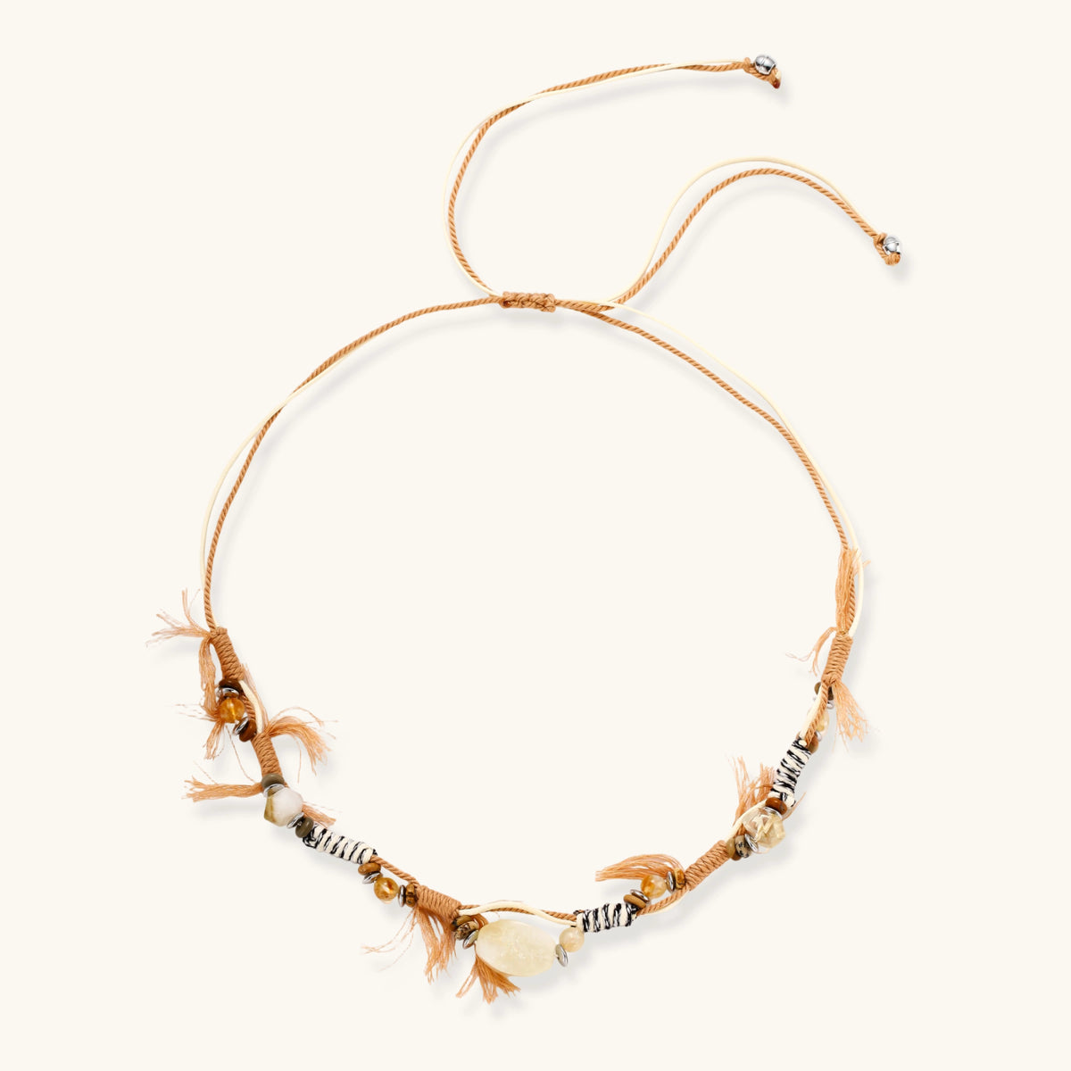 Adjustable brown cord necklace with citrine, coffee calcite beads and striped accents on white background.