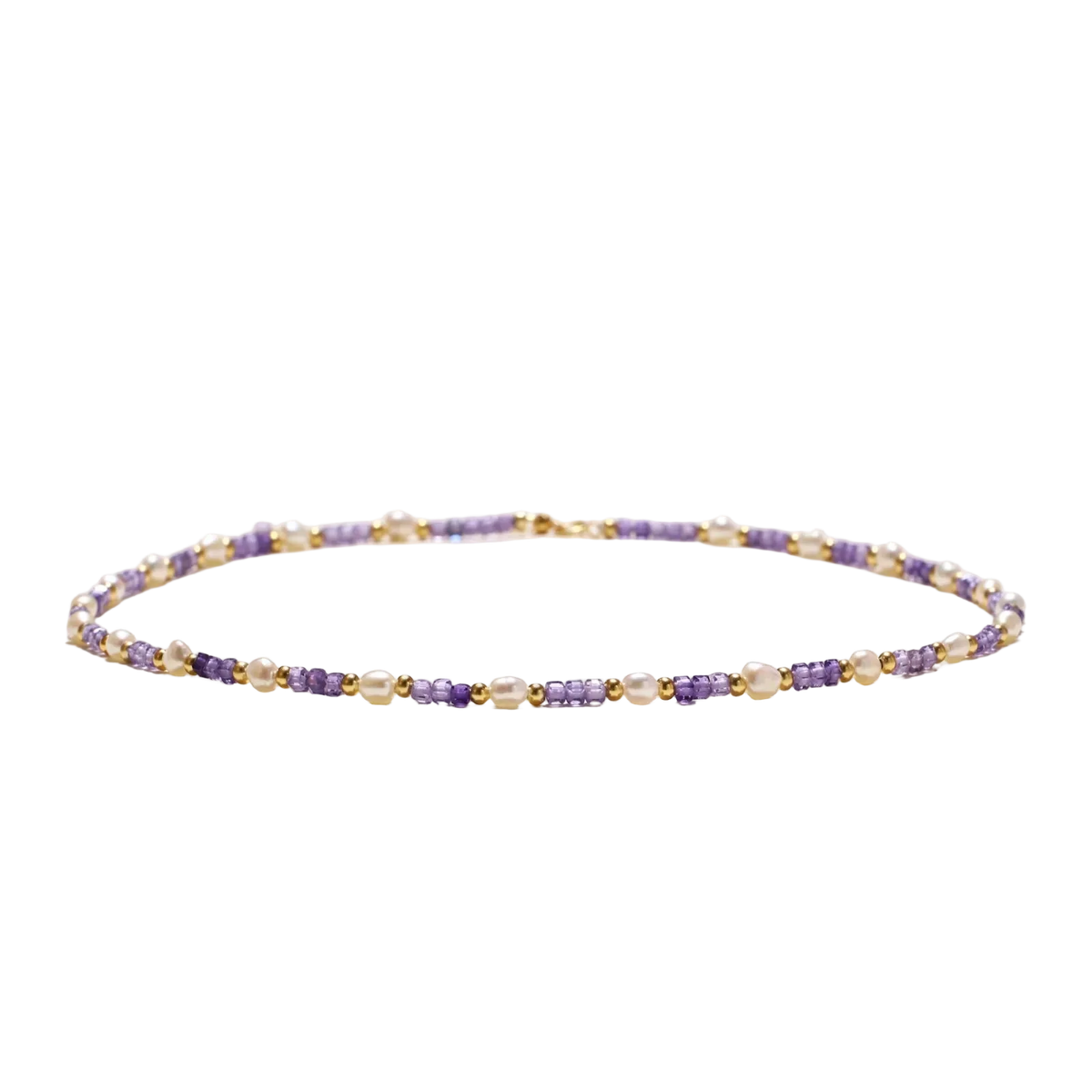 Delicate 18K gold vermeil necklace with alternating lavender zirconia beads and white freshwater pearls on cream background